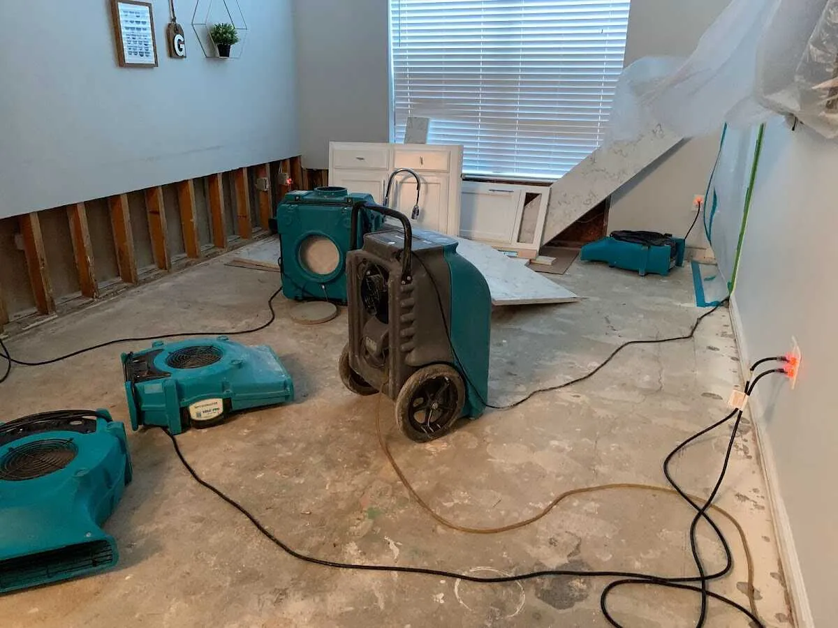 Dehumidifier in flood-cut room for Water Damage Restoration in Webster City